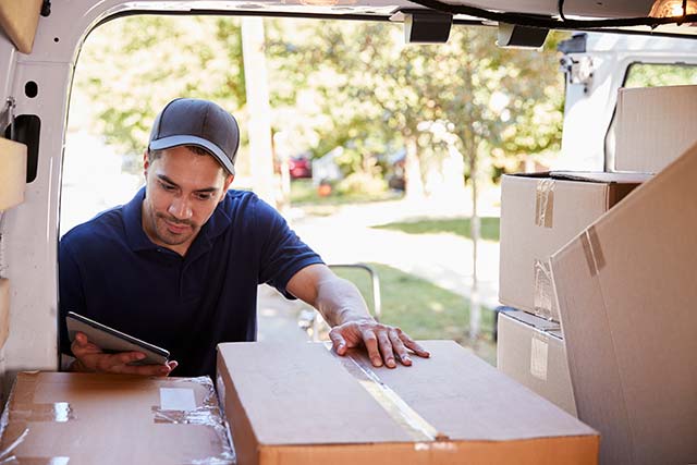 Courier looking for package in van