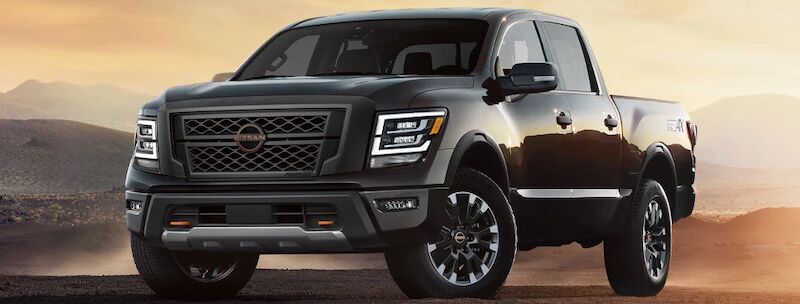 the 2024 Nissan Titan parked on a dirt road