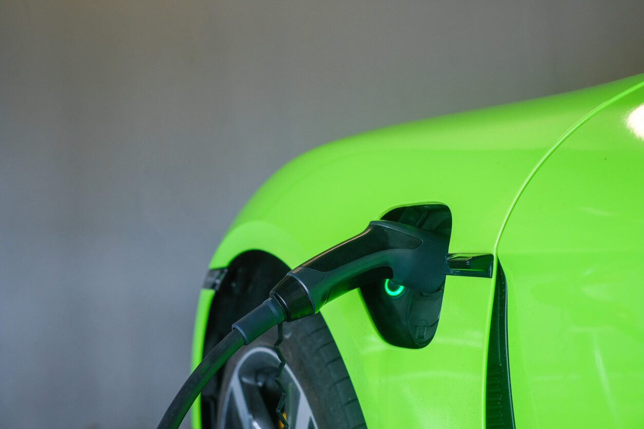 A sideview of a neon green car