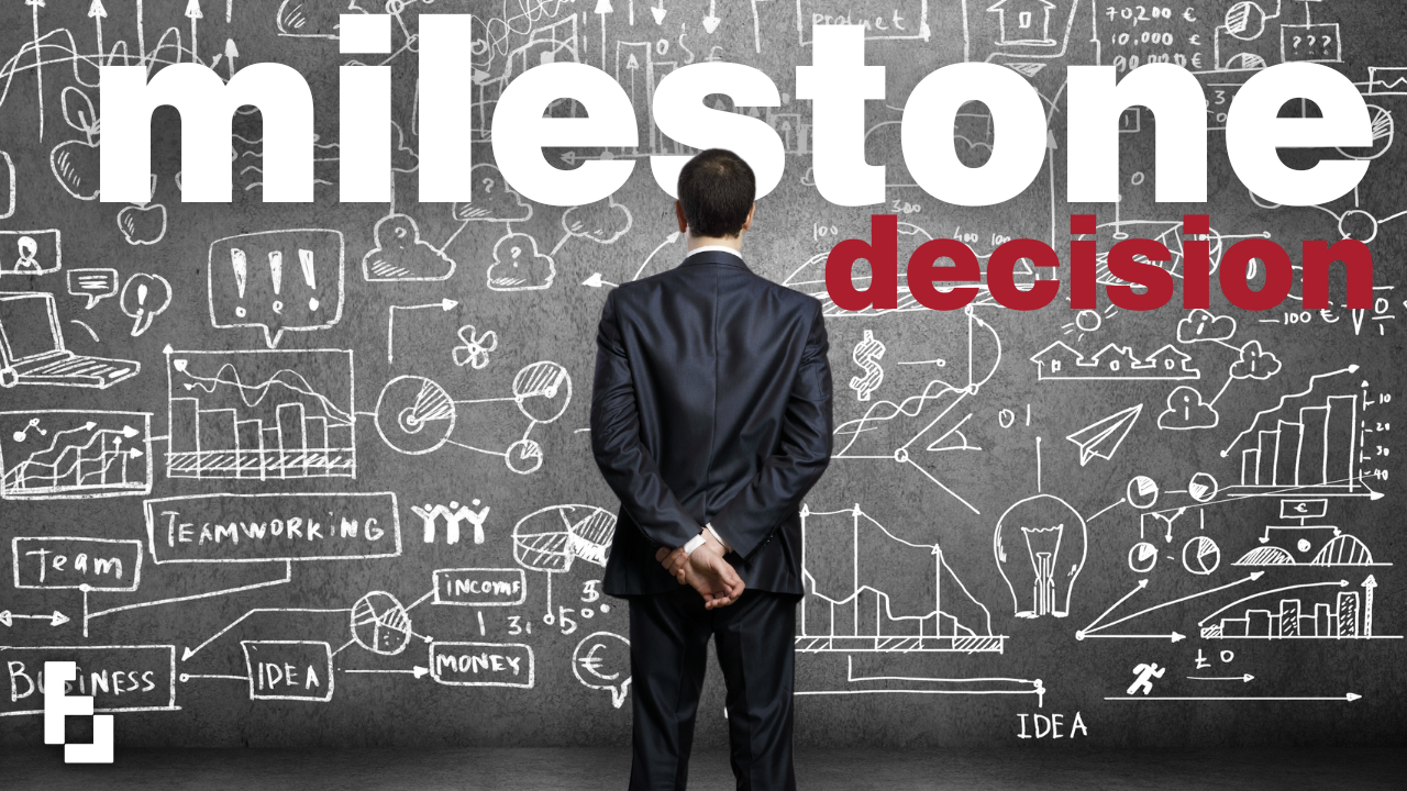A man in a suit faces a wall of business-themed sketches, with the words "milestone decision" above.