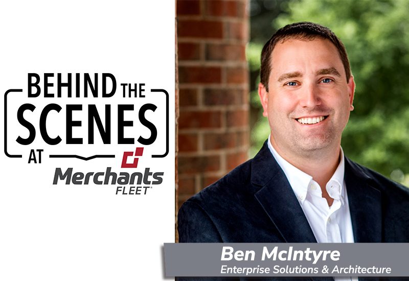 Smiling man in a suit, with text: "Behind the Scenes at Merchants Fleet" and name plate "Ben McIntyre".