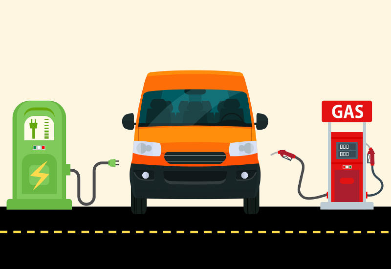 Orange van between an electric charging station and a gas pump on a road.
