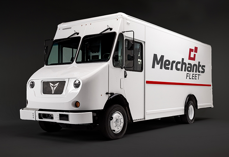 A white delivery truck with "Merchants Fleet" logo, parked against a dark background.