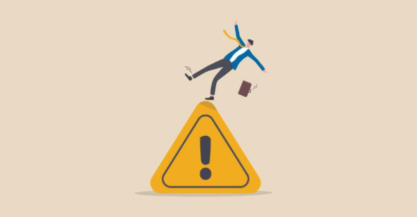 Illustration of a person losing balance on a large warning sign, symbolizing risk or caution.