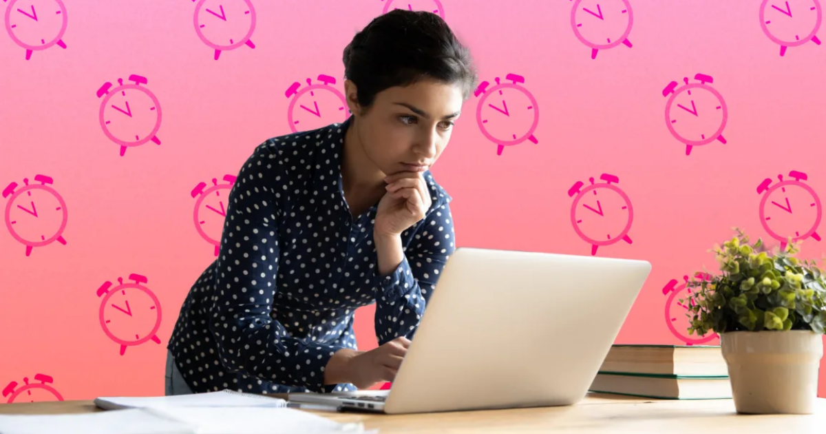 Person in polka dot shirt working on a laptop, with a clock pattern background.