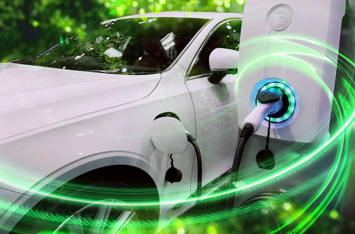 A white electric car charging, surrounded by green swirling light effects.