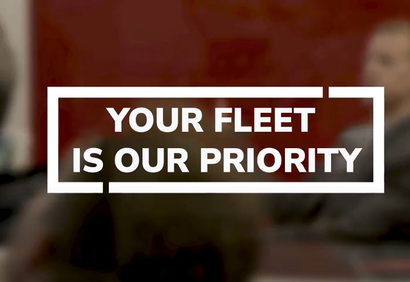 Text on a blurred background reads, "Your fleet is our priority.