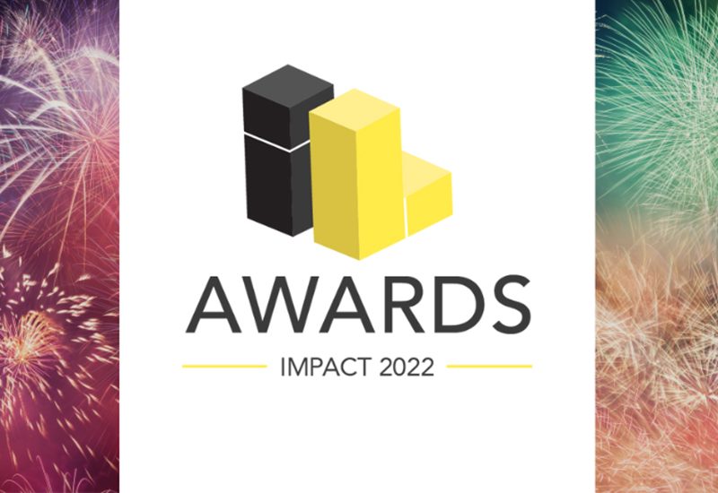 Awards logo with black and yellow blocks, text "AWARDS IMPACT 2022," colorful fireworks in the background.
