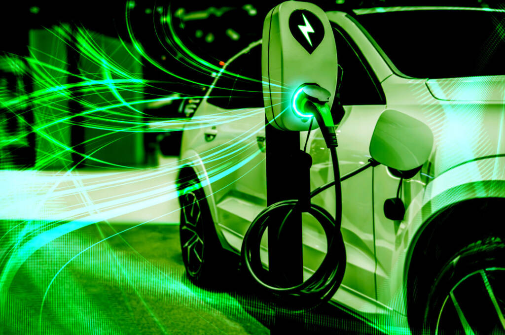 Electric car at a charging station with glowing green energy lines, symbolizing eco-friendly technology.