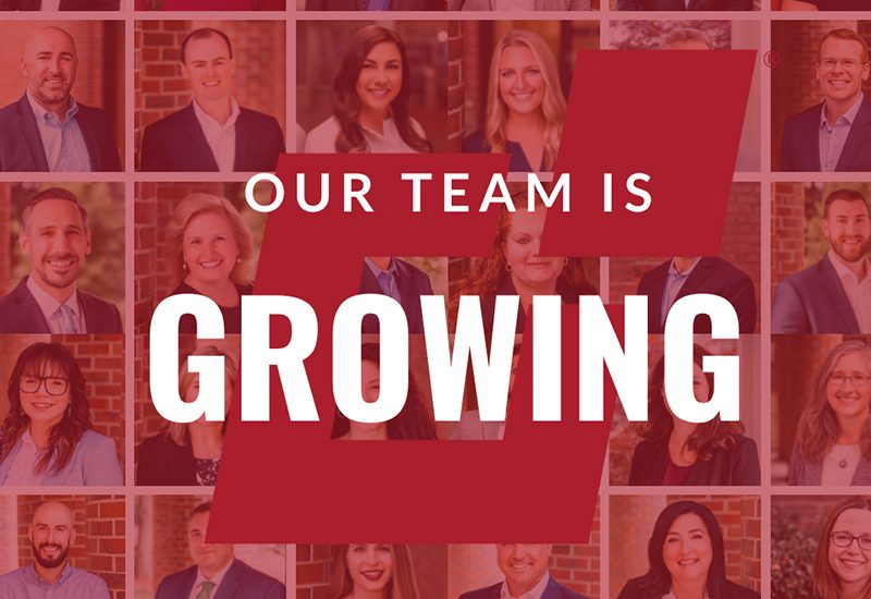 Collage of smiling people behind large text: "Our Team Is Growing" in bold white on red background.