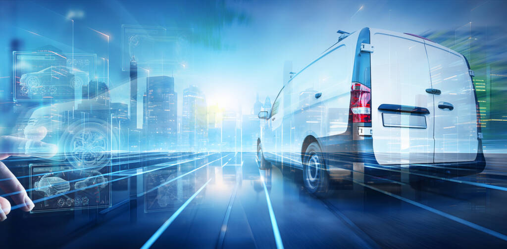Futuristic white van driving in a digital cityscape, surrounded by holographic tech displays.