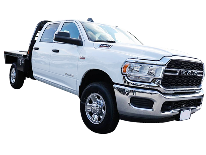 White flatbed pickup truck with a four-door cab, chrome grille, and side mirrors, viewed from the front left angle.