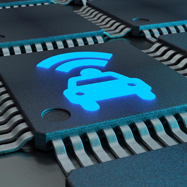 Close-up of a circuit board featuring a glowing icon of a car with a signal wave above it.