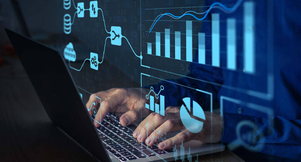 Hands typing on a laptop with overlaid graphics of charts and data flow diagrams.