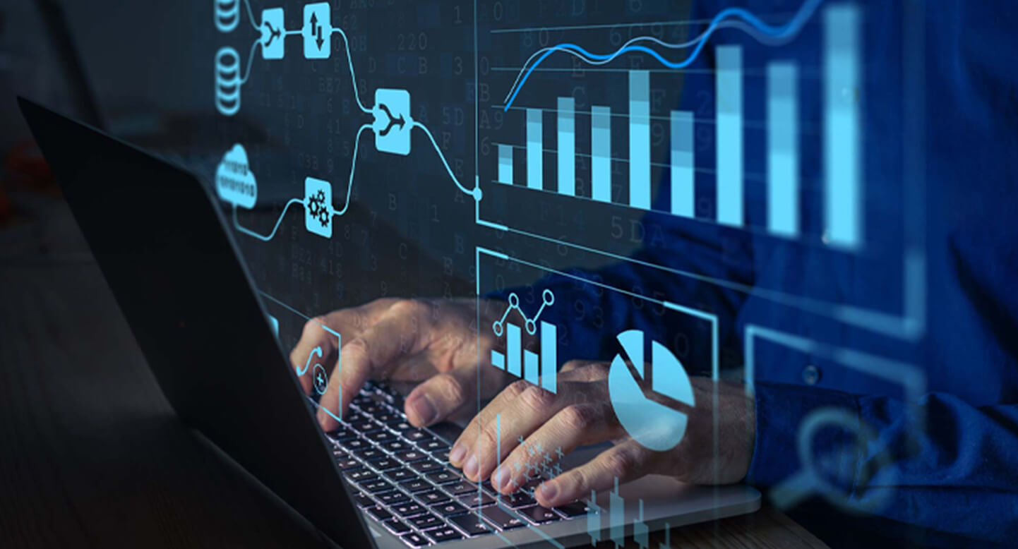 Hands typing on a laptop with overlaid graphics of charts and data flow diagrams.