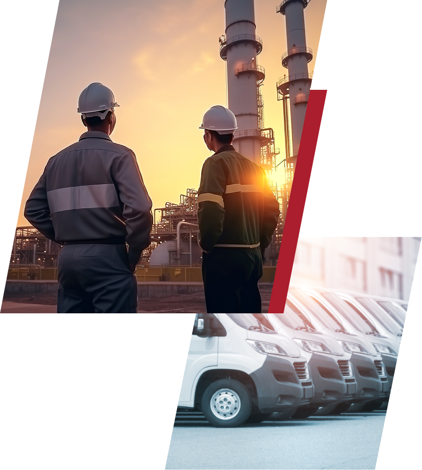 Two workers in hard hats stand near an industrial facility; row of parked vans in the foreground.